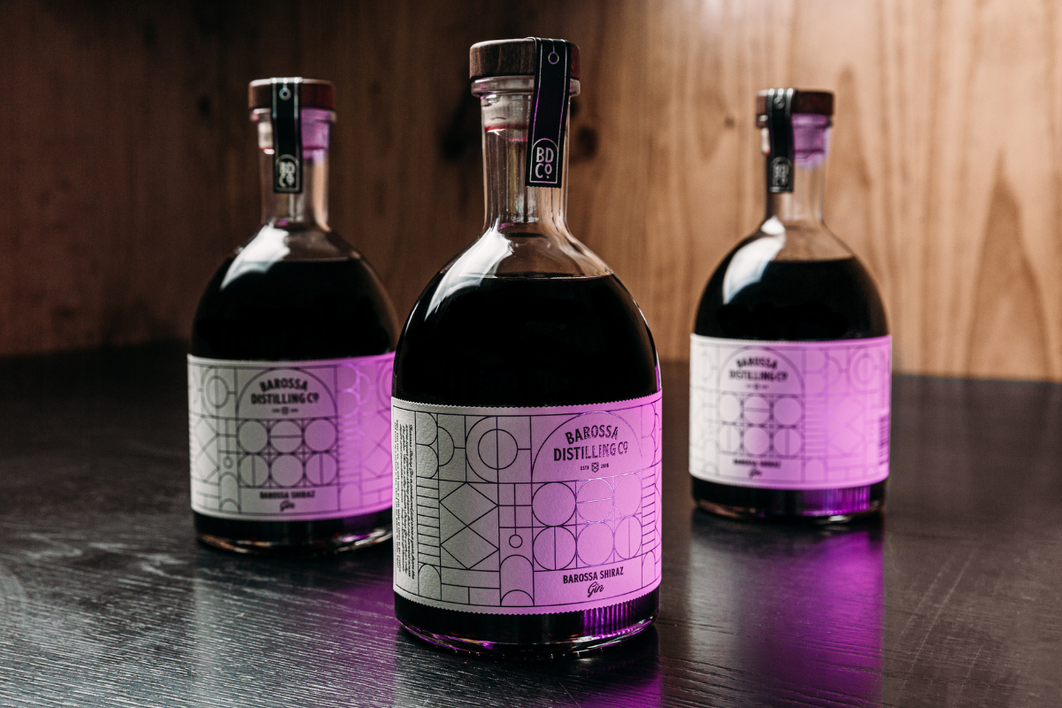 2022 Barossa Shiraz Gin bottles with purple light shining on them