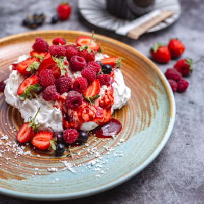 Meringue with gin soaked berries